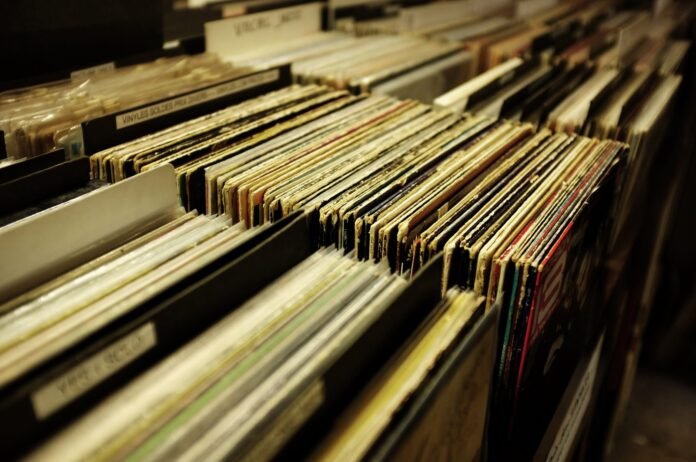 Rows of vinyl records on shelves at a record store
