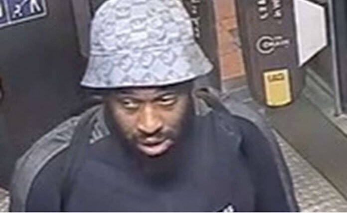 CCTV image released by British Transport Police of a man they wish to speak to after an assault at Hackney Downs station