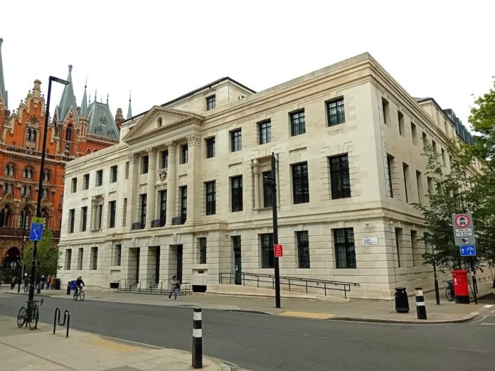 Camden Town Hall on Judd Street, built in 1937 as St Pancras Town Hall, with the gothic facade of St Pancras station behind it.