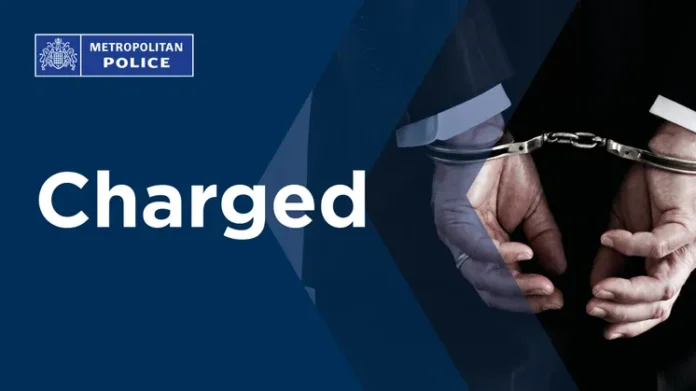 Metropolitan Police graphic announcing a charge, showing handcuffed hands