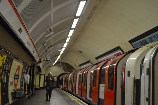 Central line London Underground train at Queensway station platform