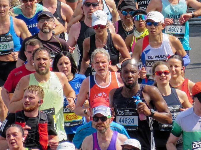 Runners in the 2026 London Marathon on Upper Thames Street, London