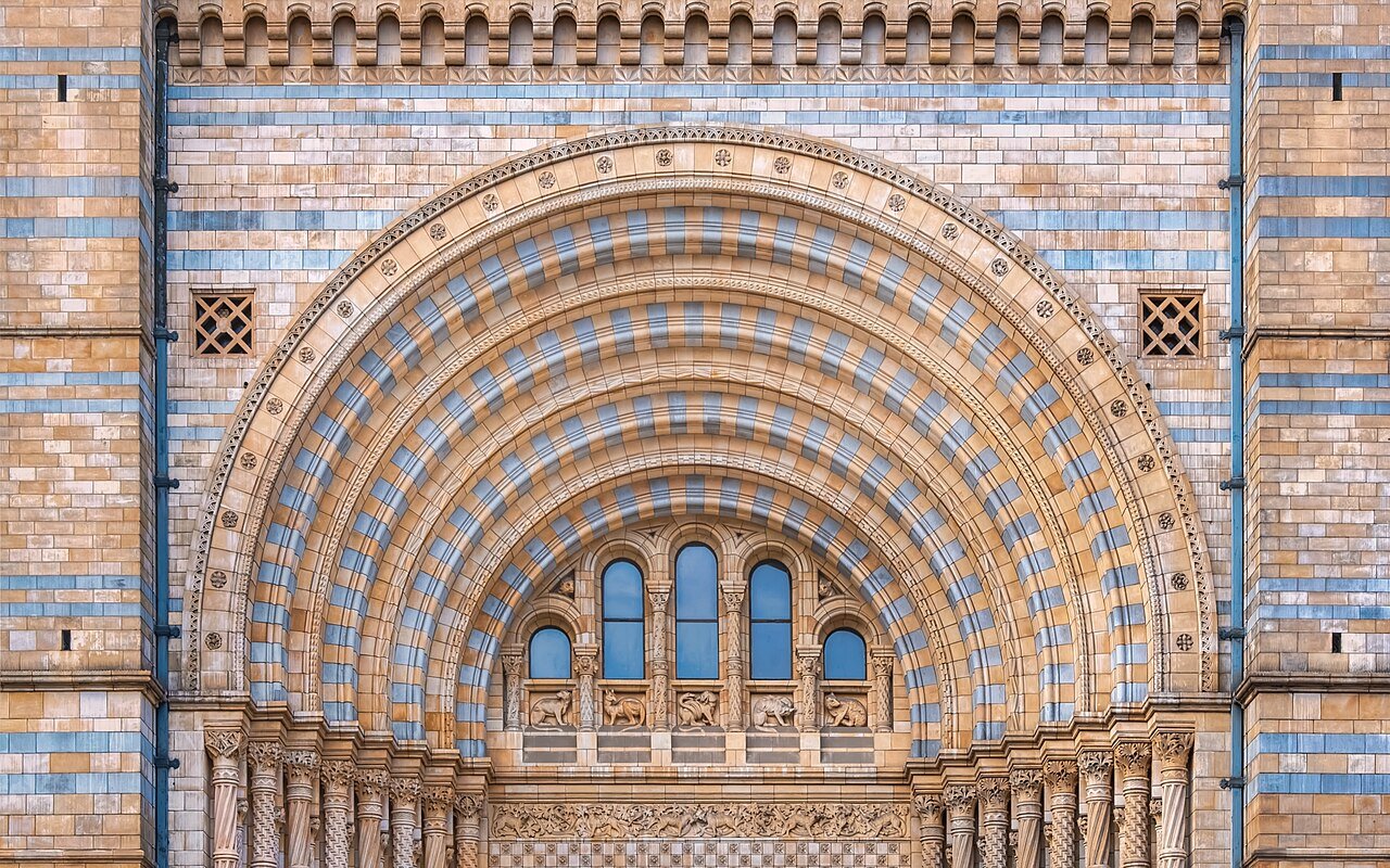 The terracotta main entrance arch of the Natural History Museum in South Kensington, London