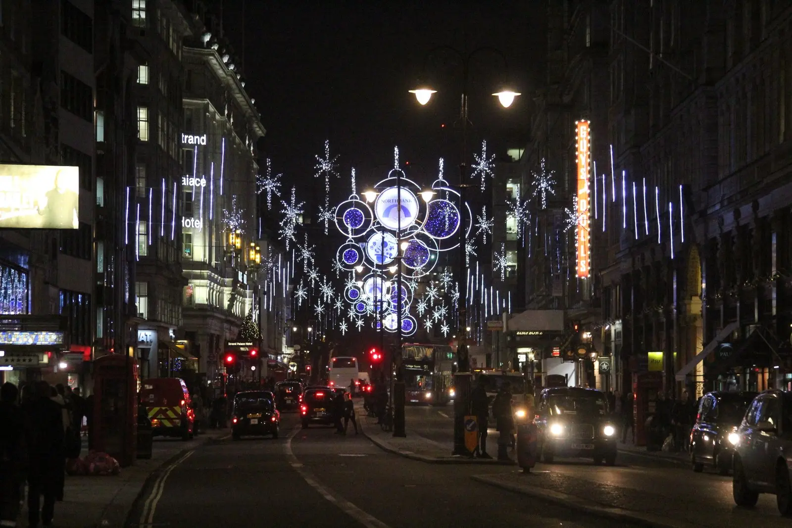 Christmas lights glowing above the Strand in London